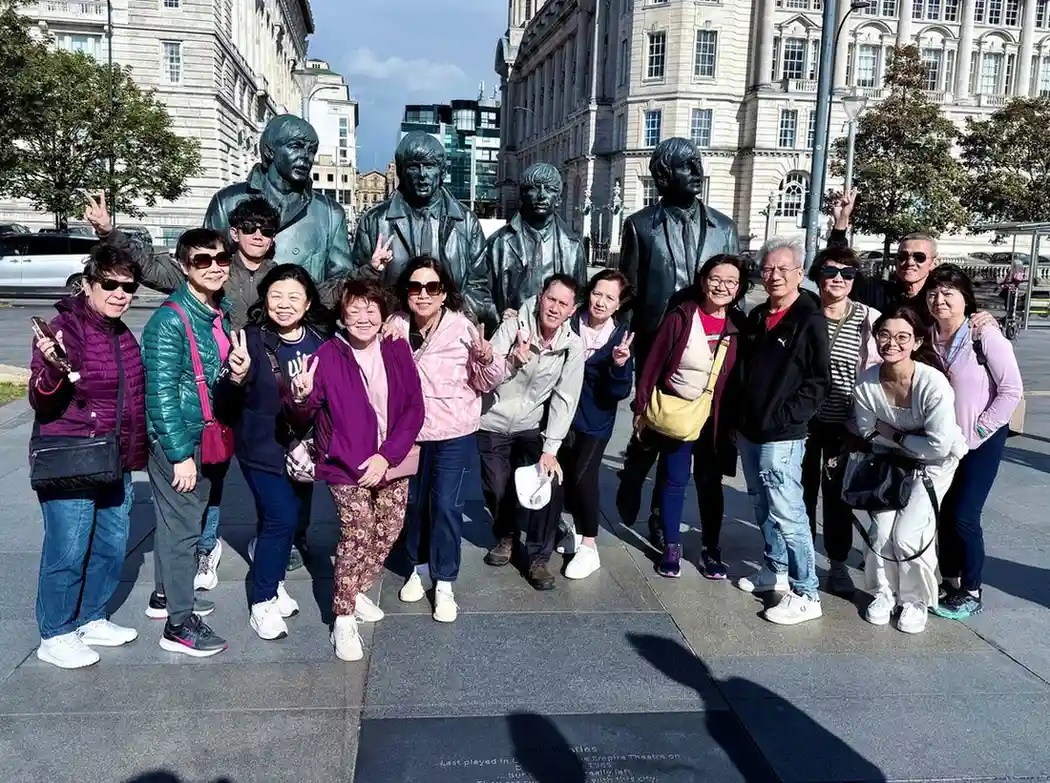Travelers posing for a group photo during the tour